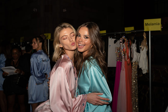 Evans Rhett and Meika Woollard backstage before walking the Sherri Hill Spring 2027 show