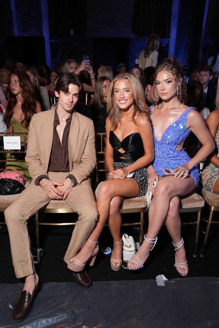 Zach Lugo, Georgia Bell Beard and Kayla Ryan on the front row at the Sherri Hill Spring 2027 show